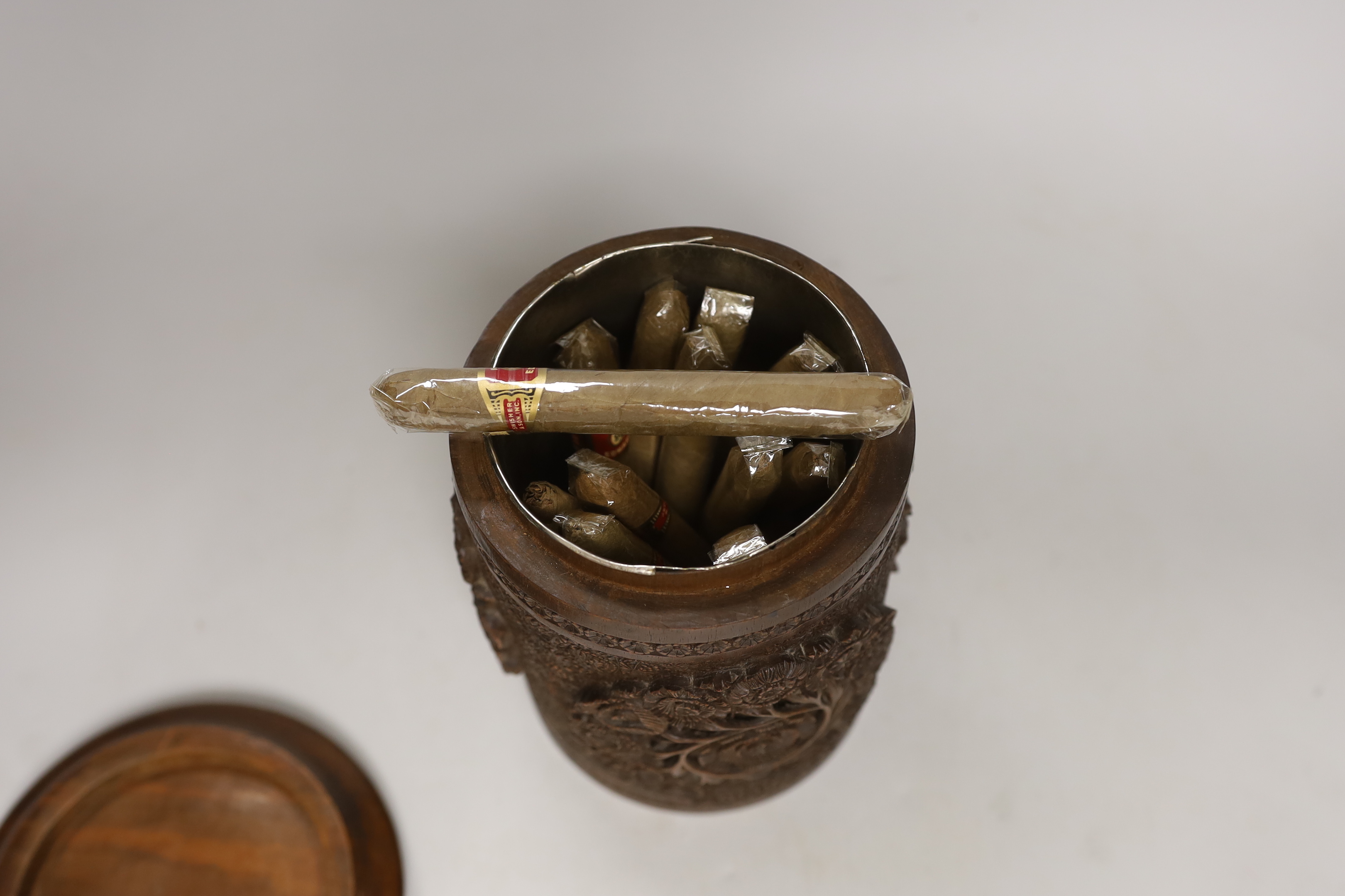 An Indian carved wood humidor and two Chinese brass mounted boxes, tallest 22cm high